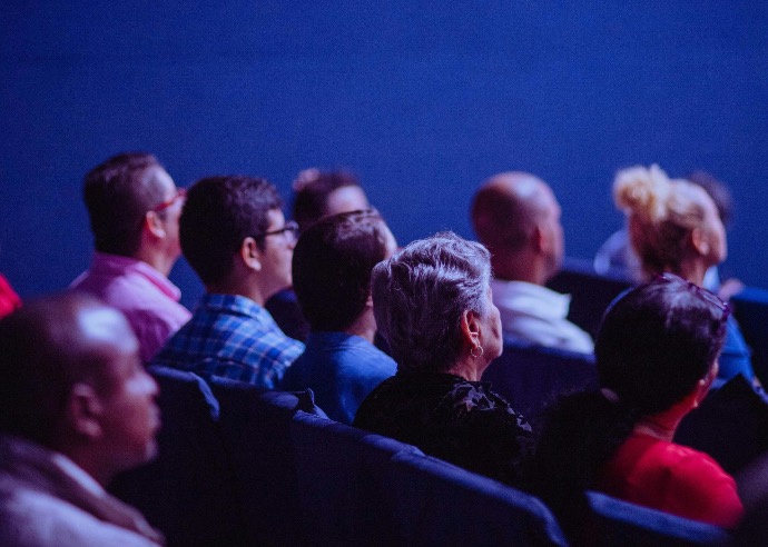 Audience of people viewing a training demonstration